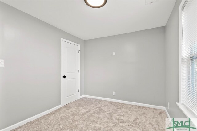 empty room with light colored carpet