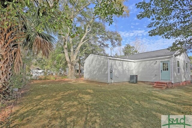 view of yard with central AC