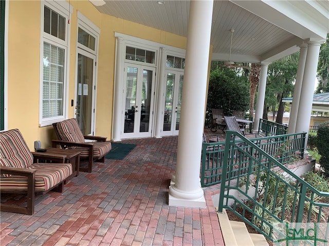 view of patio / terrace featuring french doors and covered porch