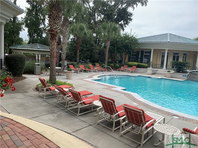 view of swimming pool featuring a patio