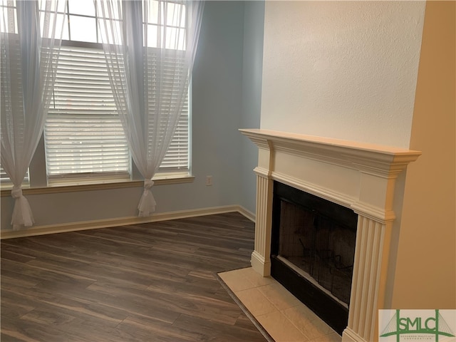 unfurnished living room featuring hardwood / wood-style floors