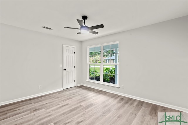 spare room featuring ceiling fan and light hardwood / wood-style flooring