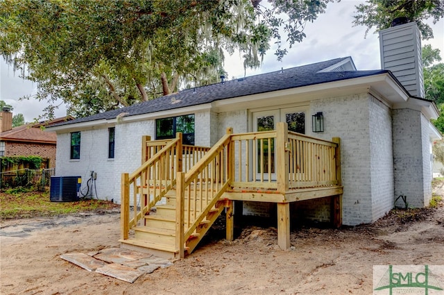 rear view of property with central air condition unit