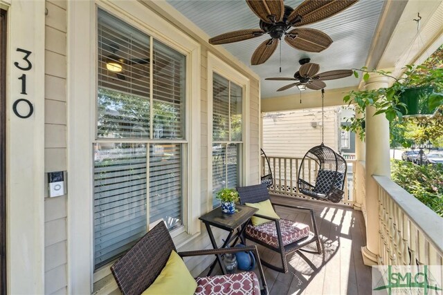 balcony featuring ceiling fan and a porch