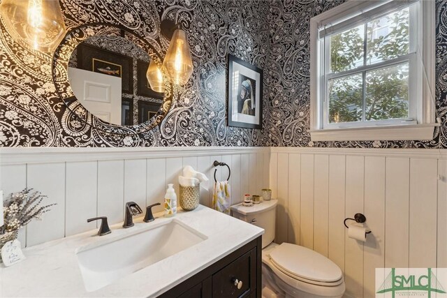 bathroom with vanity and toilet