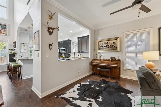 interior space featuring dark wood-style floors, recessed lighting, baseboards, and crown molding