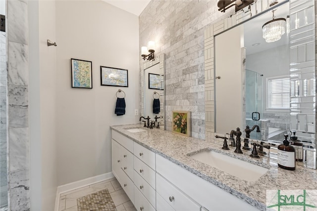 bathroom with walk in shower, tile patterned flooring, and vanity