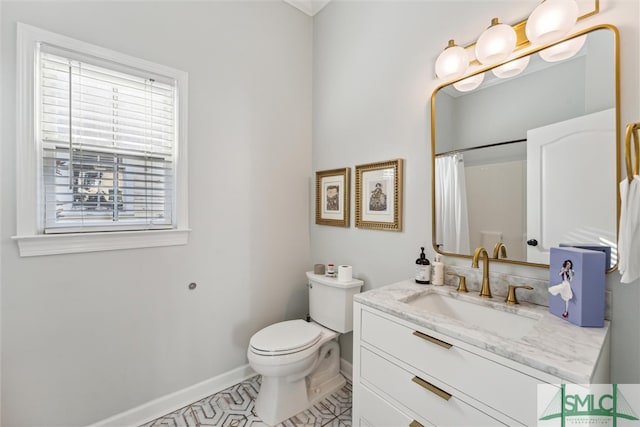 bathroom with curtained shower, vanity, toilet, and tile patterned floors