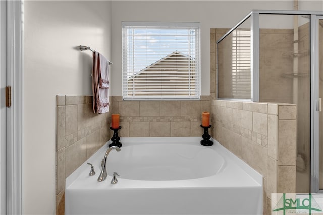 bathroom with separate shower and tub