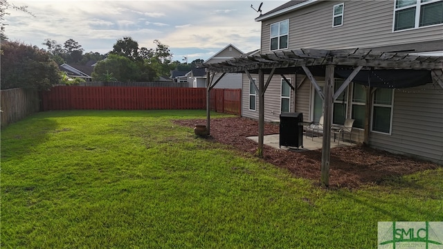 view of yard with a pergola and a patio