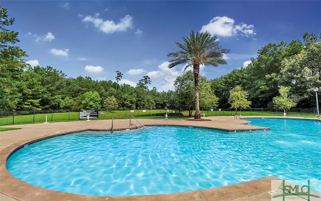 view of swimming pool with a patio area