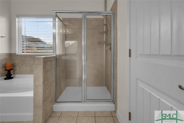 bathroom featuring independent shower and bath and tile patterned floors