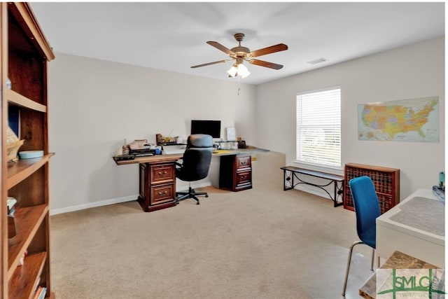 office area with light colored carpet and ceiling fan