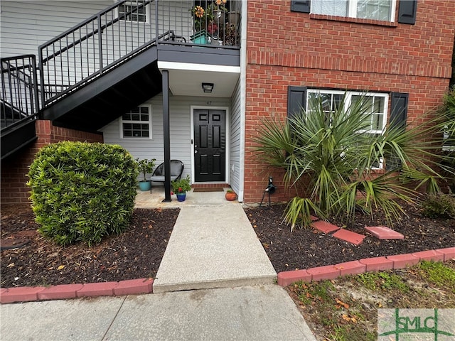 entrance to property with a balcony