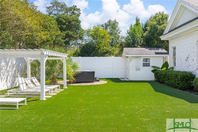 view of yard featuring a patio area, an outdoor structure, and a pergola