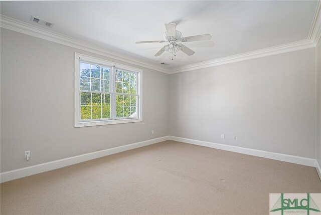 carpeted spare room featuring crown molding and ceiling fan