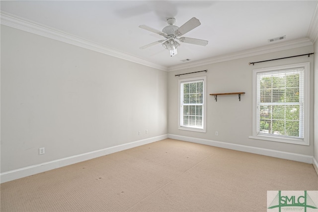 carpeted spare room with crown molding and ceiling fan