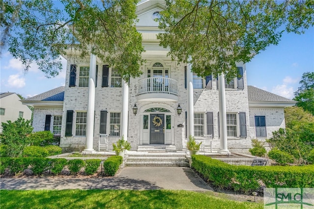 neoclassical / greek revival house with a balcony