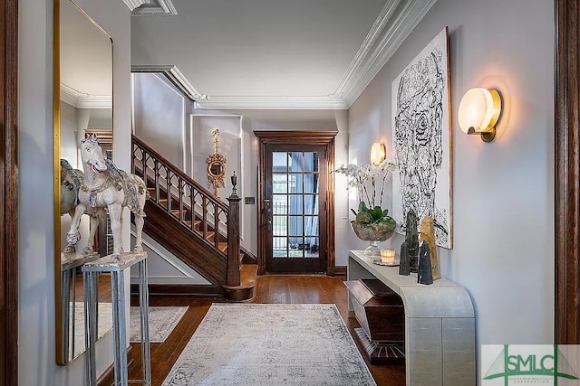 entryway with crown molding and dark wood-type flooring