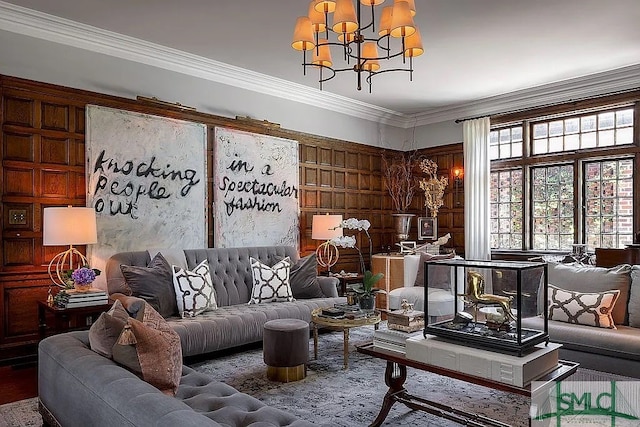 living room featuring crown molding, a chandelier, and wood walls