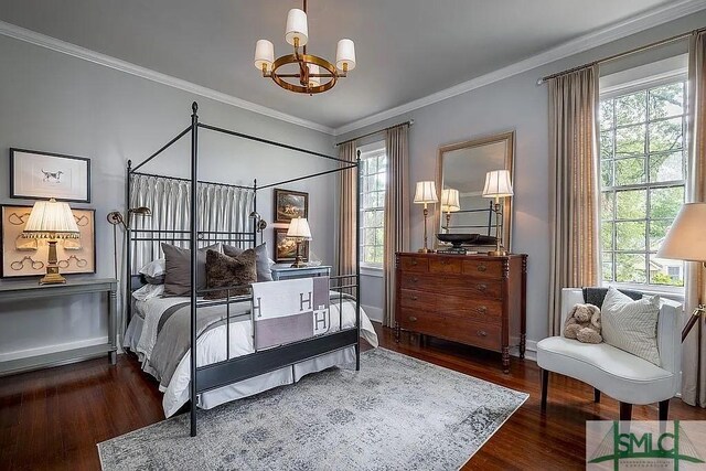 bedroom featuring a notable chandelier, dark hardwood / wood-style flooring, and crown molding