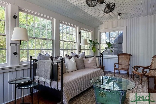 sunroom with lofted ceiling and wooden ceiling