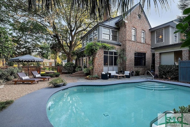 view of swimming pool featuring a patio