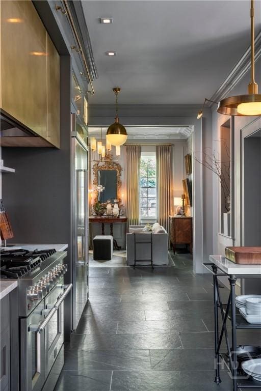 56 E 54th St, Savannah, GA 31405 - kitchen with premium appliances, light countertops, pendant lighting, and ornamental molding