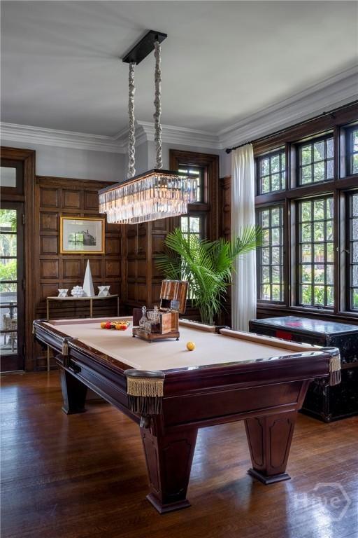 56 E 54th St, Savannah, GA 31405 - rec room with pool table, plenty of natural light, wood finished floors, and ornamental molding