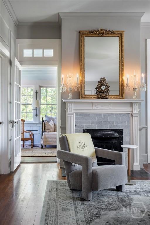 56 E 54th St, Savannah, GA 31405 - living area with a tile fireplace, crown molding, and wood finished floors