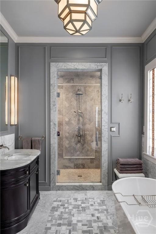 56 E 54th St, Savannah, GA 31405 - bathroom featuring a stall shower, a freestanding bath, vanity, plenty of natural light, and crown molding