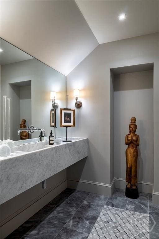 56 E 54th St, Savannah, GA 31405 - bathroom with vaulted ceiling and vanity