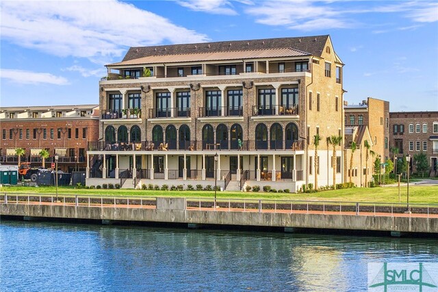 view of building exterior with a water view