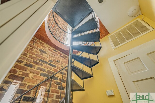115 W Gordon St, Savannah, GA 31401 - stairs featuring brick floors
