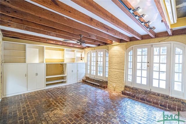 115 W Gordon St, Savannah, GA 31401 - unfurnished living room featuring french doors, ceiling fan, beamed ceiling, and brick floors