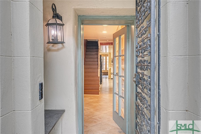 hallway featuring light tile patterned flooring