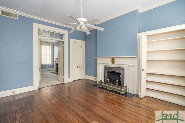 unfurnished living room featuring crown molding, dark hardwood / wood-style flooring, and ceiling fan