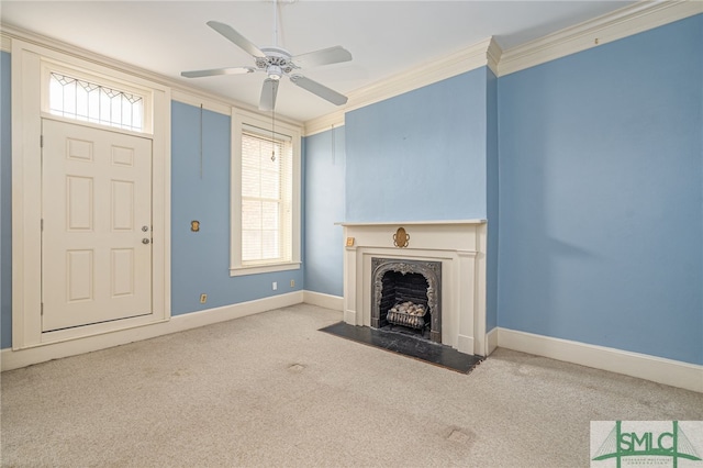 unfurnished living room featuring crown molding, light colored carpet, a healthy amount of sunlight, and ceiling fan