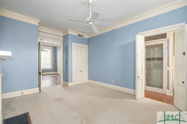 unfurnished bedroom with ceiling fan, carpet, and ornamental molding