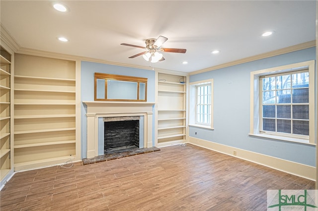 unfurnished living room featuring crown molding, ceiling fan, and hardwood / wood-style floors