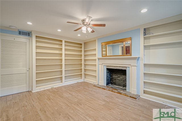 unfurnished living room featuring crown molding, wood-type flooring, and ceiling fan