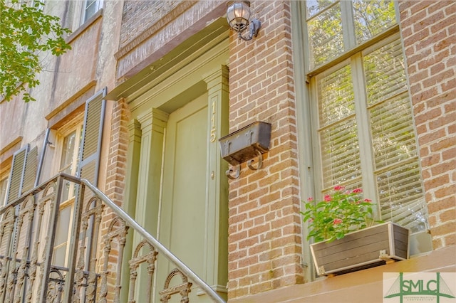 115 W Gordon St, Savannah, GA 31401 - view of exterior entry featuring brick siding