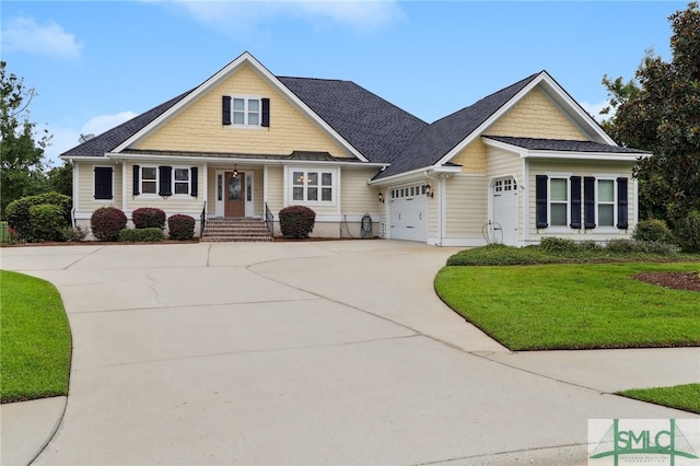 view of front facade with a garage and a front lawn