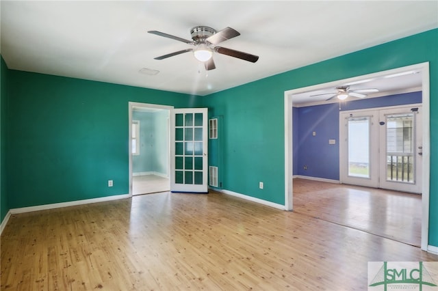 unfurnished room with light hardwood / wood-style floors, ceiling fan, and french doors