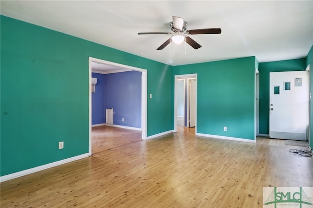 spare room featuring light hardwood / wood-style floors and ceiling fan