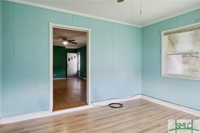 unfurnished room with light hardwood / wood-style flooring, ceiling fan, and crown molding