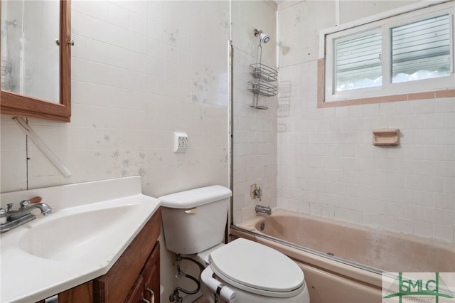 full bathroom with shower / bath combination with glass door, vanity, and toilet