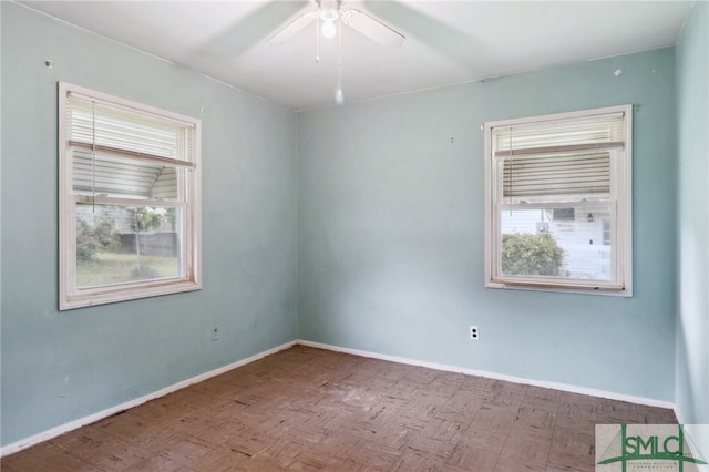 unfurnished room featuring ceiling fan and wood-type flooring