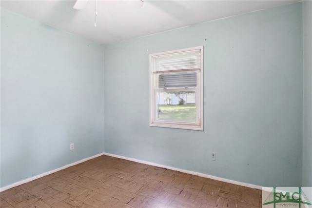 spare room featuring ceiling fan