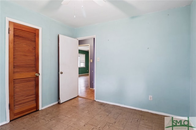 unfurnished bedroom featuring a closet and ceiling fan